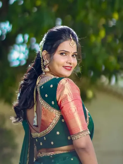 A lovely over-the-shoulder shot showcasing her hairstyle.