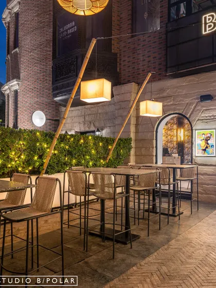 The outdoor seating area for Burosu at 32nd Avenue offers a more relaxed ambiance. We used high-top tables and simple bamboo-supported lanterns to extend the restaurant's atmosphere into the open air.