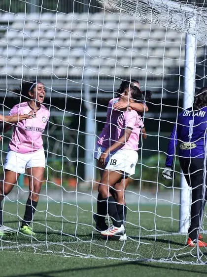A goalmouth scramble, with our players celebrating as the ball hits the back of the net.