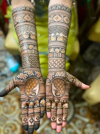 A duplicate of image 66, highlighting the prominent peacock figures on the palms.
