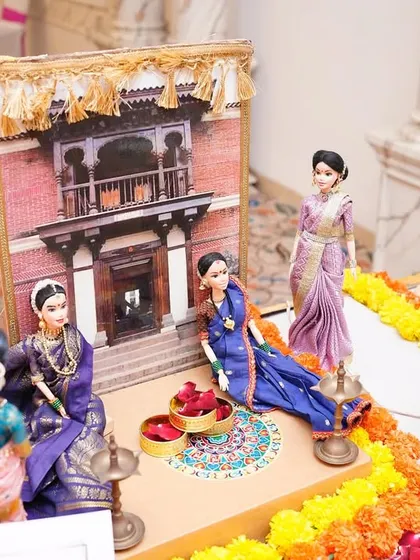 This vignette from a baby shower rukhwat depicts a traditional Maharashtrian 'wada' or ancestral home, symbolizing family roots and the welcoming of a new generation.
