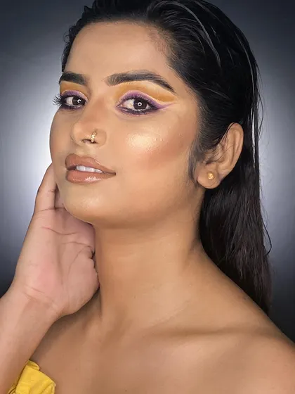 A slightly different angle of the portfolio look, highlighting the glowing highlighter and wet-look hair, techniques essential for editorial and fashion makeup.