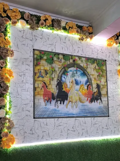 The final look of the decorative flower and light frame. This is a great way to highlight a piece of art or create a feature wall in a bedroom or living room.