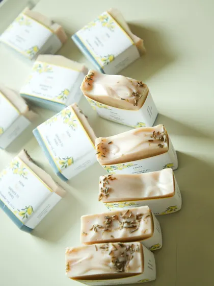 A stack of the Amalfi-inspired bridal shower favors, showing the lavender buds embedded in the soap.