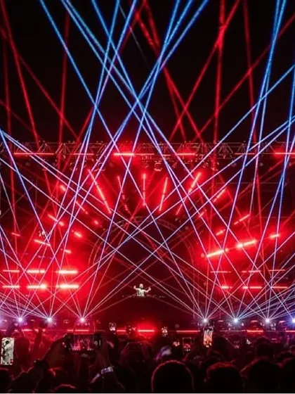 A symphony of red and blue lasers cutting through the darkness during Zedd's incredible Telos Tour. I use lighting to build energy and create a dynamic visual landscape for the music.