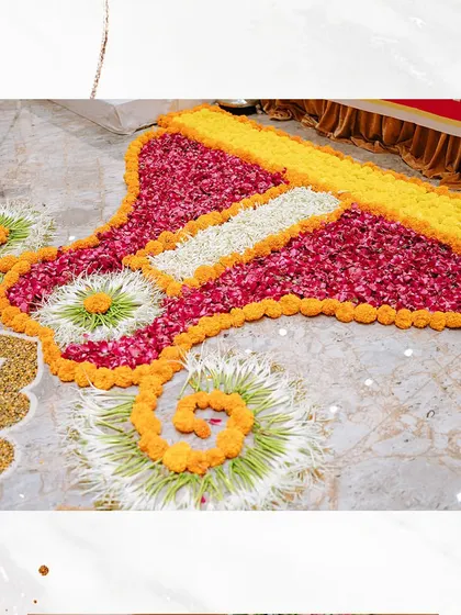 A beautiful floral rangoli created for a Siddh Chakra Pujan, marking the auspicious start of a couple's wedding journey. We scrupulously create each detail for the big day.