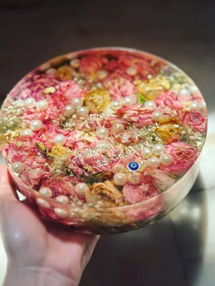 A side view of the 7-inch deep circular block, showing the dimension and how the flowers are layered throughout the resin. This depth creates a beautiful, immersive effect.