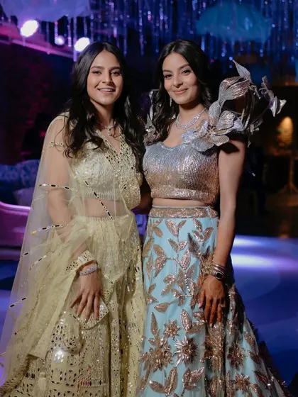 The two sisters together at the Sangeet. I created looks that complemented each other while suiting their individual styles.