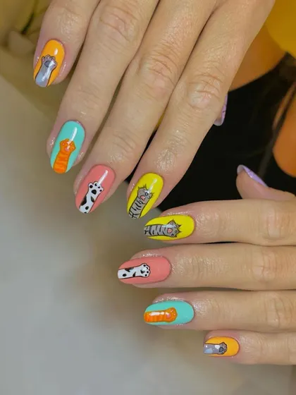 For all the cat lovers out there. This super cute set features different hand-painted cartoon cats on each nail, each with its own colorful background.