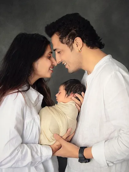 That new parent glow is undeniable. I love capturing these intimate, happy moments between mom and dad as they admire their beautiful newborn baby together.