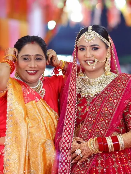 A beautiful moment between a bride and her mother, both looking radiant with makeup done by me.