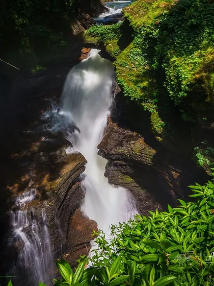 The powerful Devi's Fall in Nepal, a stunning natural wonder we often visit as part of the cultural immersion during our Annapurna expeditions.