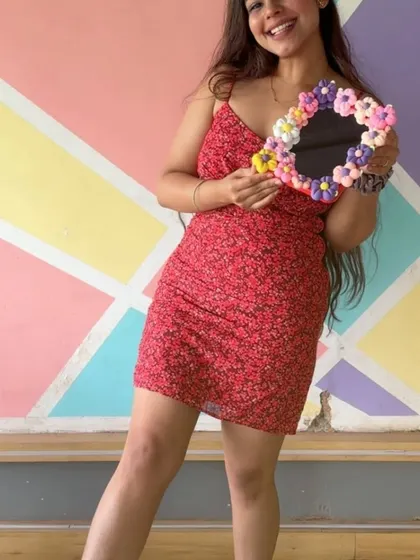 She's all smiles with her new handmade clay mirror. A perfect accessory and a great memory.