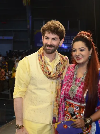 Sharing a moment with actor Neil Nitin Mukesh at the 'Rangilo Re' Navratri event. I am experienced in hosting celebrities and ensuring they have a seamless and enjoyable experience on stage.