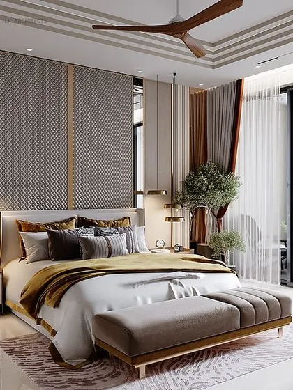 A wider view of the grey and gold bedroom, showing how the design extends to the attached balcony. The seamless transition between indoor and outdoor space enhances the feeling of luxury and openness.
