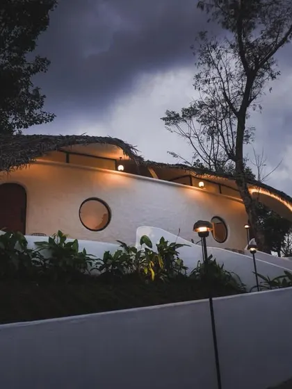 We champion innovation in sustainable design. This eco-retreat by Raving Dots Studio merges parametric modeling with vernacular techniques, resulting in a ferrocement shell that grows from the land with minimal environmental impact.