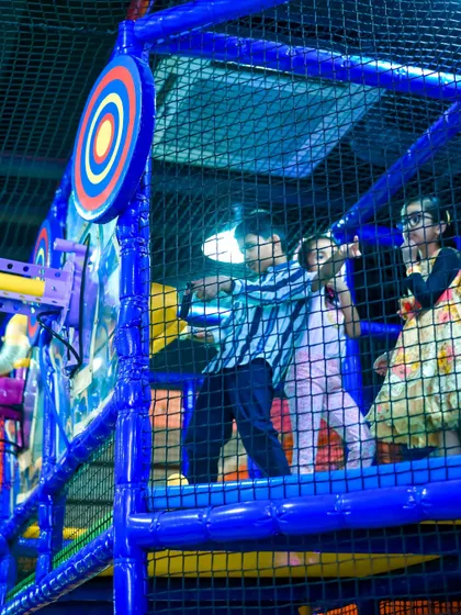 Kids aiming for the target with our air-powered soft ball cannons. This interactive game is a highlight of the My Maze area.