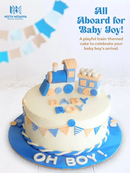 A full view of the "Oh Boy!" train cake, a perfect centerpiece for a baby shower.