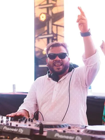 Pointing to the crowd, feeling the energy. Holi gigs are always special.