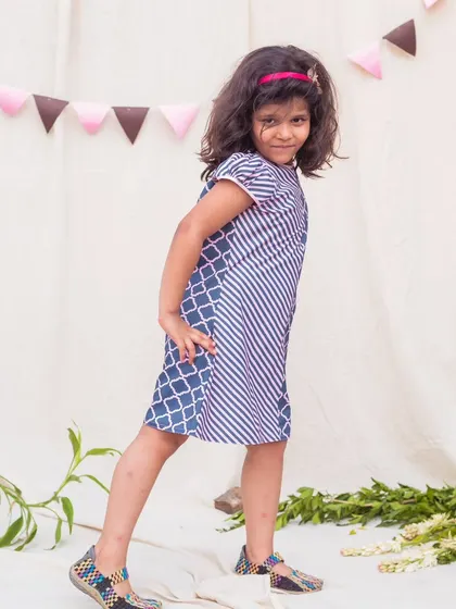 Posing with confidence in this cool, contemporary printed dress. The easy-to-wear A-line shape makes it a go-to choice for any casual occasion.