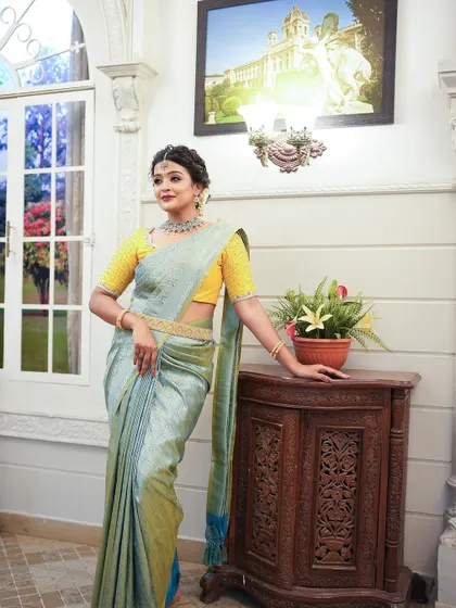 The full saree look, showing the beautiful drape and the elegant setting.