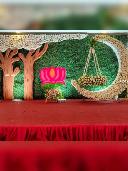 A close-up of the floral moon cradle and backdrop.