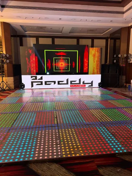 The complete setup for a cocktail night, featuring a full LED dance floor, a large video wall, and professional speakers. I ensure the entire production is top-notch for an insane party experience.
