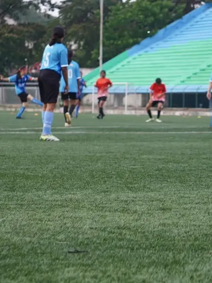 Our players in their iconic blue kits press the opposition, showcasing their relentless energy and commitment.