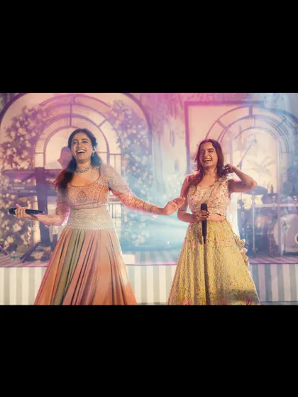 A candid moment of joy on stage with a fellow performer. These are the happy memories I cherish.