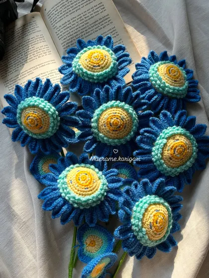 A close-up shot of the intricate, multi-toned centers of our blue crochet sunflowers, designed to mimic the brushstrokes of a painting.