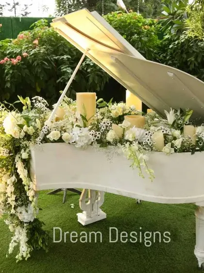 It's the unique details that tell your story. I transformed this grand piano into a stunning floral installation, overflowing with white blooms and candles, creating a memorable and artistic focal point for the event.