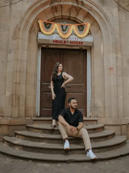 A chic and stylish portrait on the steps of a heritage building. This shot from their Mumbai pre-wedding session has a cool, editorial feel.