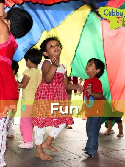 The rainbow parachute is always a favorite. This group activity promotes teamwork and communication as children work together to make colorful waves and play games.