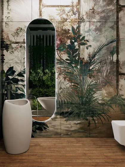 This tropical bathroom concept was one of my favorites to design. The feature wall with lush, botanical tiles and the freestanding pedestal sink create the feeling of being in a luxurious outdoor shower.