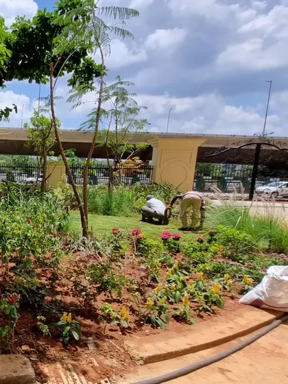 Our gardeners at work, tending to a new flower bed. The health and maintenance of the landscapes we install are just as important as the initial design.