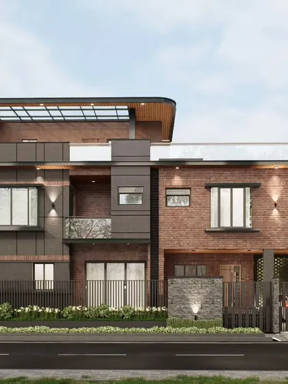 A direct frontal view of the Prestige Great Acres villa concept. This shows the symmetrical and balanced composition, with bay windows and balconies providing views of the surrounding greenery.