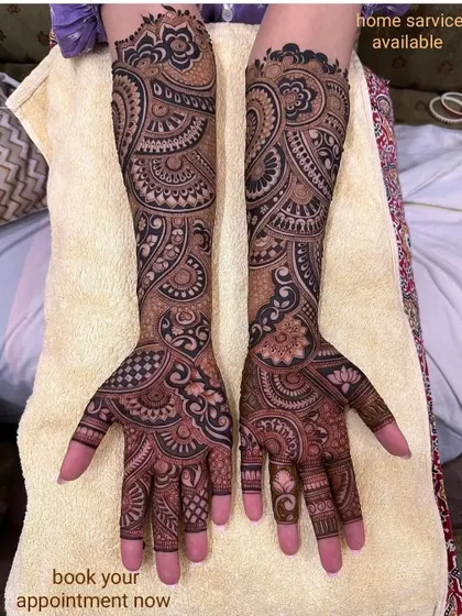 A classic full-coverage design with a mix of paisley, floral, and geometric elements. The dark stain shows the quality of my henna.