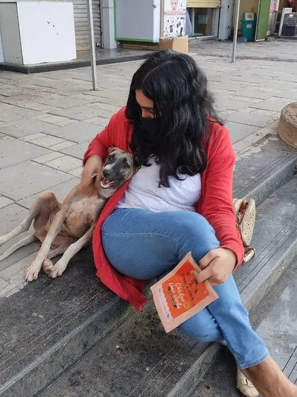There's no better way to celebrate a milestone than by sharing the joy with dogs. Here I am, post certification, relaxing with a sweet Indie dog. My work is driven by a genuine connection with these animals.