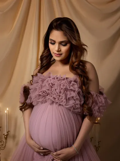 A close-up that highlights her beautiful makeup and the intricate details of the gown's bodice.