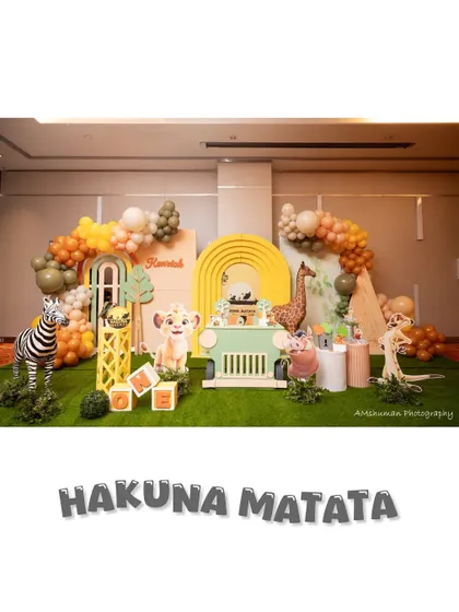 We specialize in bringing epic stories to life, like this 'Hakuna Matata' Lion King party. This wide view shows our custom multi-panel backdrops, life-sized animal props including a zebra and Pumbaa, and a safari jeep cake stand, all designed to transport your guests to the Pride Lands.