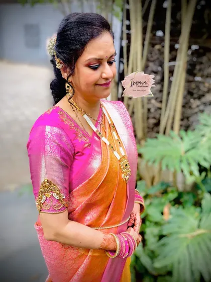 A radiant makeover for the mother of the bride. The makeup enhances her features with a skin-like finish, ensuring she looks graceful and feels her best.