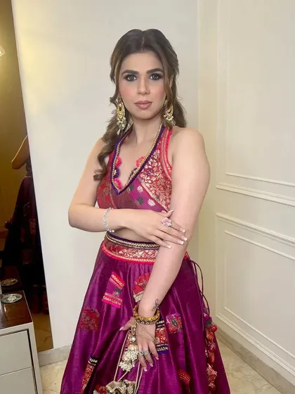 A side view of a half-up hairstyle with curls, showing the detail of the twists and the volume of the hair. This is a versatile look for any wedding function.