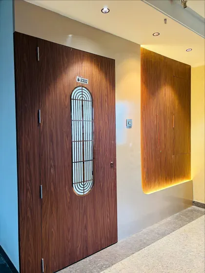 Next to the door, I added a backlit wooden panel to create ambient lighting and add a decorative touch to the entryway.