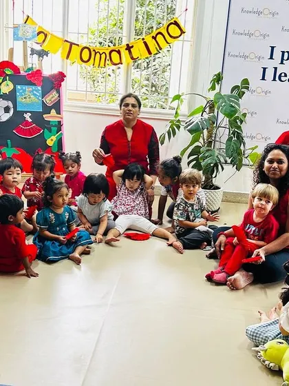 The whole school community gathers for a group photo during our Tomatina festival, celebrating Spanish culture together.