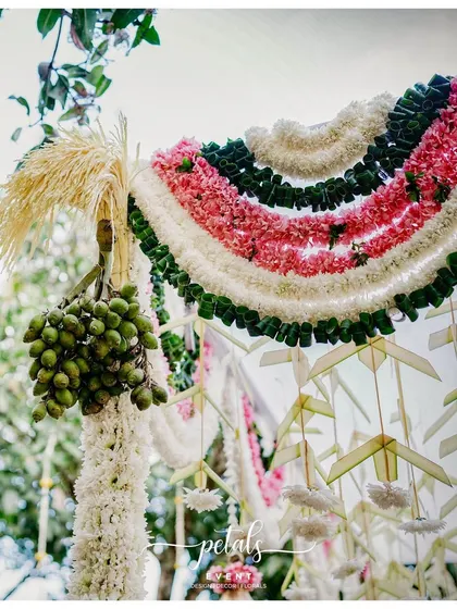 A beautiful detail of a mandap, with garlands of chrysanthemums, nerium, and areca nuts.