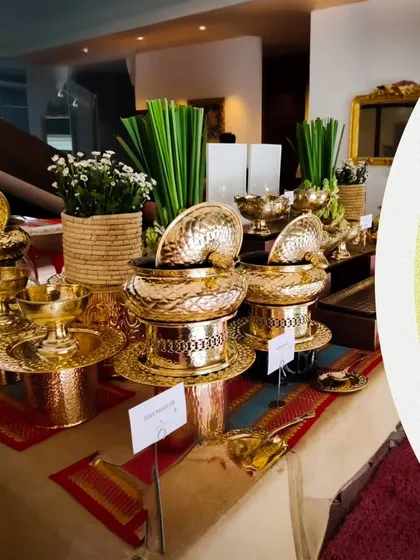 A divine culinary journey for Navratri. This image shows an elegant buffet setup with traditional golden serveware, ready to enchant your guests with flavor and finesse.