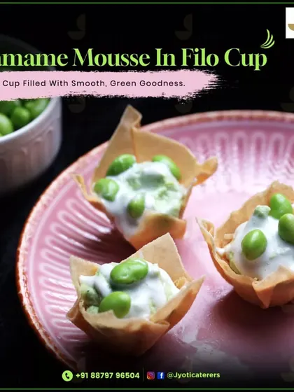 Edamame Mousse served in a crispy filo cup. This elegant canapé offers a delightful contrast of textures with its smooth, green goodness and crunchy shell.