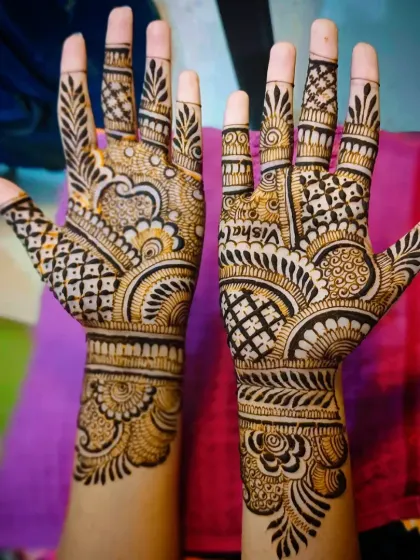 A clear shot of the 'Vishal' mehandi design, showing the name on the palm.