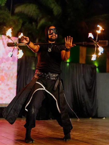 A male fire dancer puts on a spectacular show, combining athleticism and artistry. I source top-tier entertainers to match the high-end quality of your event.