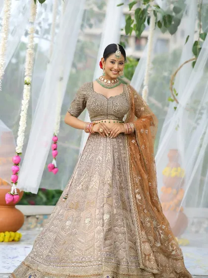 This image captures the bride's serene beauty. The soft-glam makeup with a nude lip and defined eyes is perfect for the modern bride who wants an elegant look.